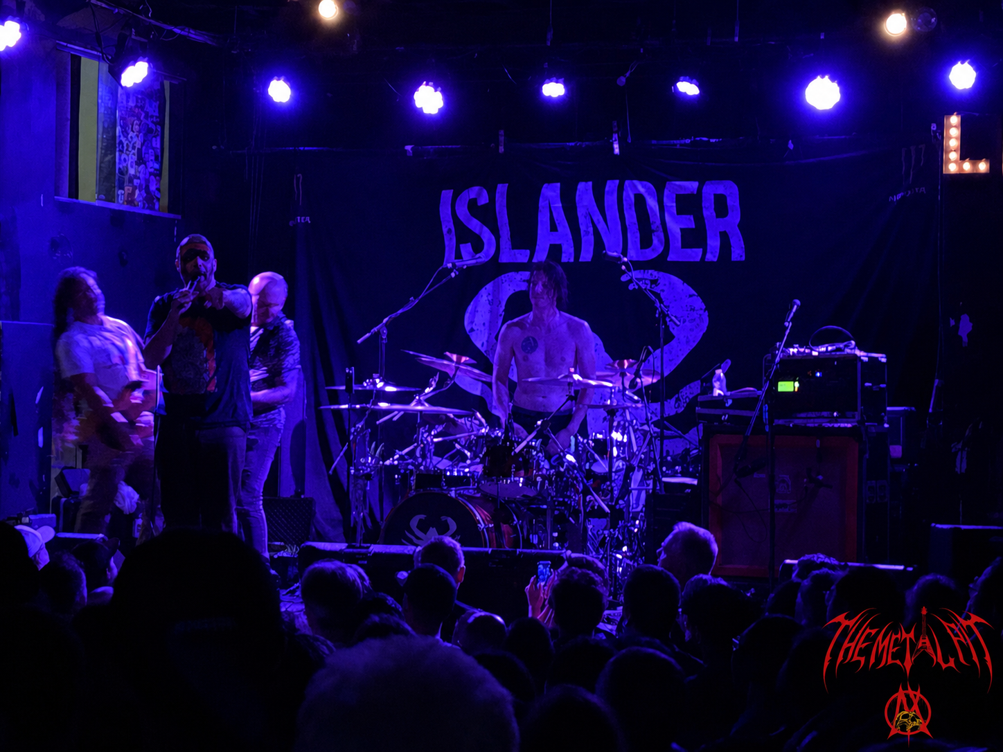 Islander performing under purple lights at Lee's Palace