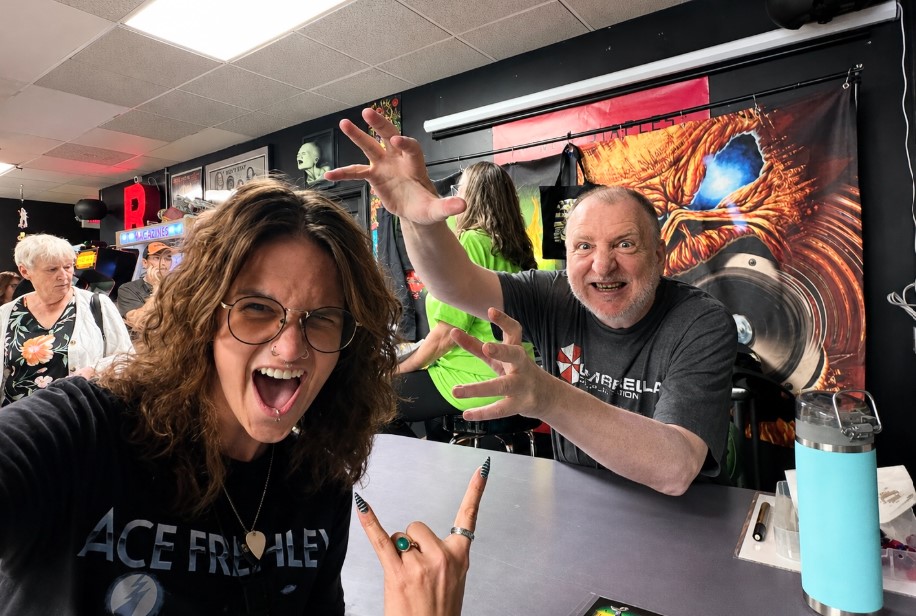 Writer Marsworth with artist Derek Riggs at a record store in Ohio